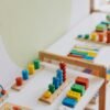 pexels-mikhail-nilov-8923982 Jeu d'Éveil Montessori en Bois – Formes, Couleurs & Motricité